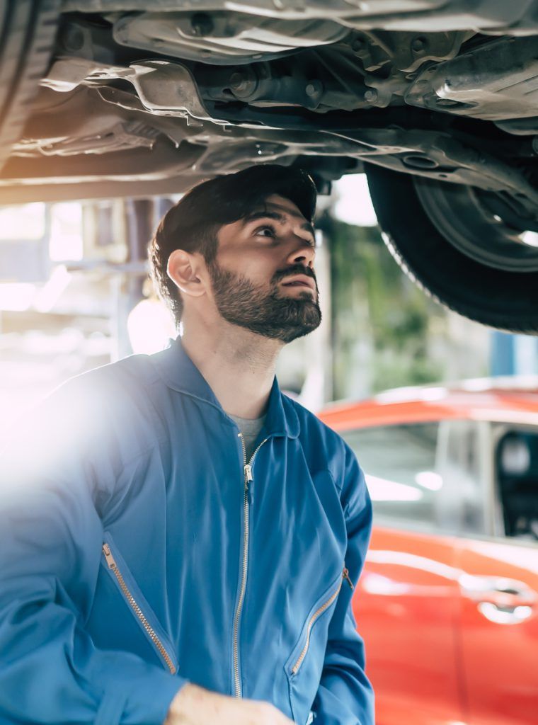 MOT mechanic inspecting a vehicle